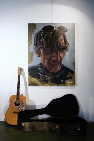 Tom's guitar and case, with portrait by Abe Zucca. - ABE ZUCCA GALLERY