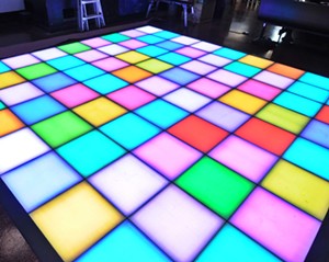 The light-up disco dance floor at Stardust Pinbar. - BENJAMIN LEATHERMAN