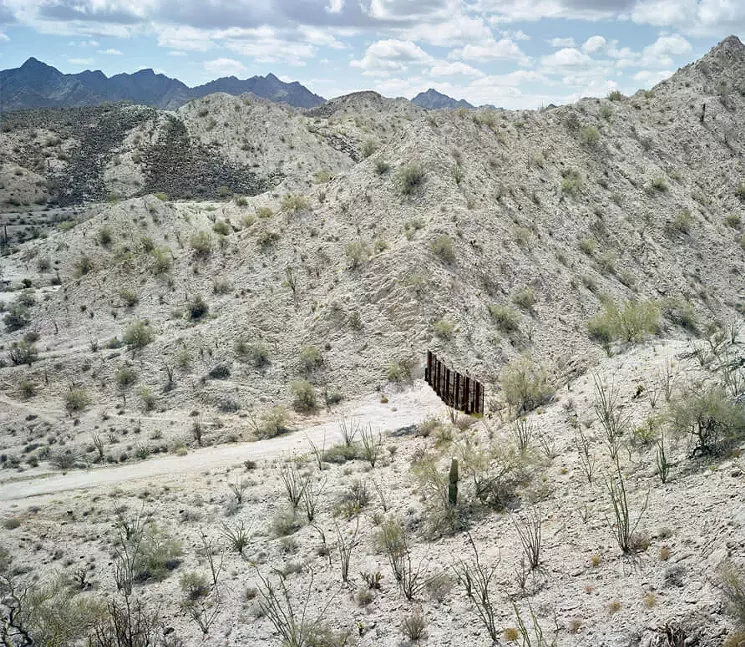 Mark Klett, Fence separating the US/Mexico border south of the Gila Mountains, May 2015. Pigment print, edition of 20, available in three sizes. - LISA SETTE GALLERY