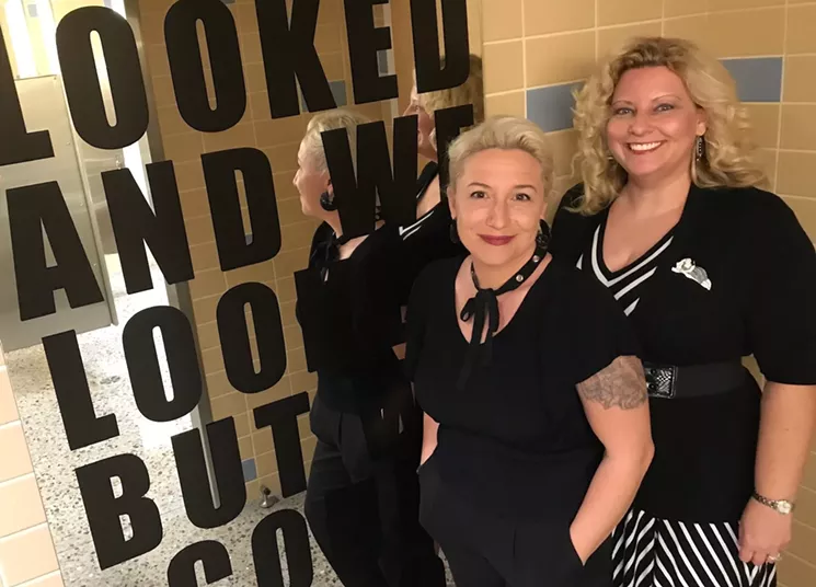Kristin Bauer (left) and Tiffany Fairall, with work Bauer recently installed at the museum. - LYNN TRIMBLE