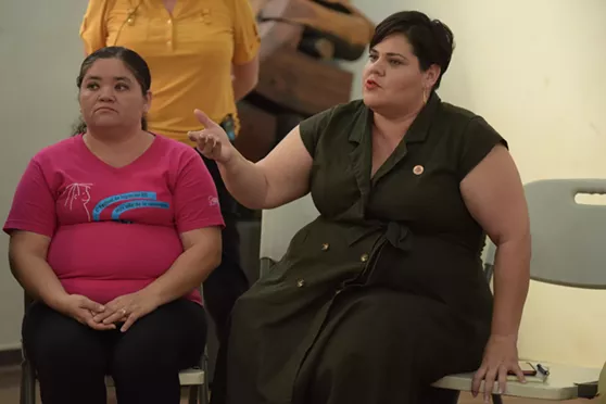 Representative Terán, right, learns about a sex education program for adolescents in El Salvador, who account for a third of all births in the country. - MENLY CORTEZ FOR STATE INNOVATION EXCHANGE