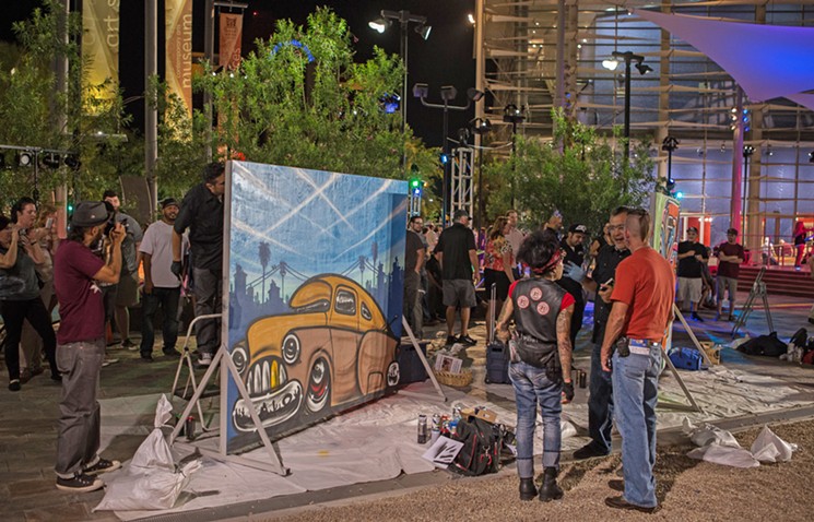 Pausing from live painting. - MESA ARTS CENTER