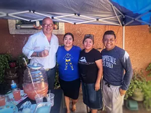 From left, Andrew Zimmern, Abril Gallardo, Sandra Felicidad Cervera Gallardo, and Raul Gallardo Jr. take a break during filming an episode of What's Eating America. - FELICIDAD CATERING