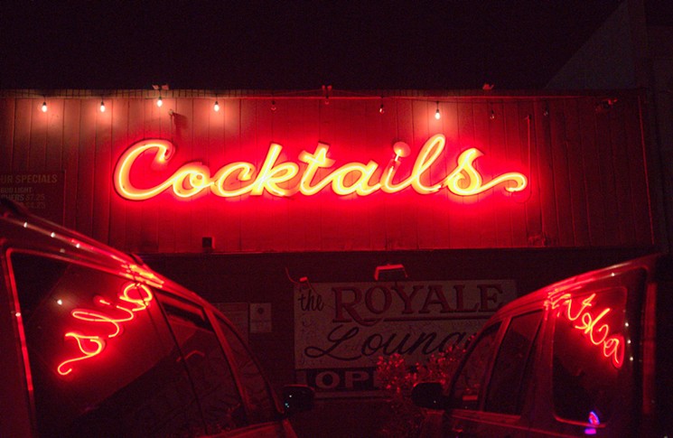 The neon sign outside of notorious central Phoenix dive bar Royale Lounge. - BENJAMIN LEATHERMAN