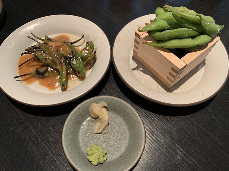 Shishito peppers and complimentary edamame are starters that make an impression. - RUDRI BHATT PATEL