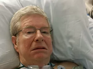 Douglas Brackett, an Ahwatukee 78 year old, communicates with his tongue and eyes. He's seen here during an earlier hospitalization. - COURTESY OF CARRIE CHAPPELL