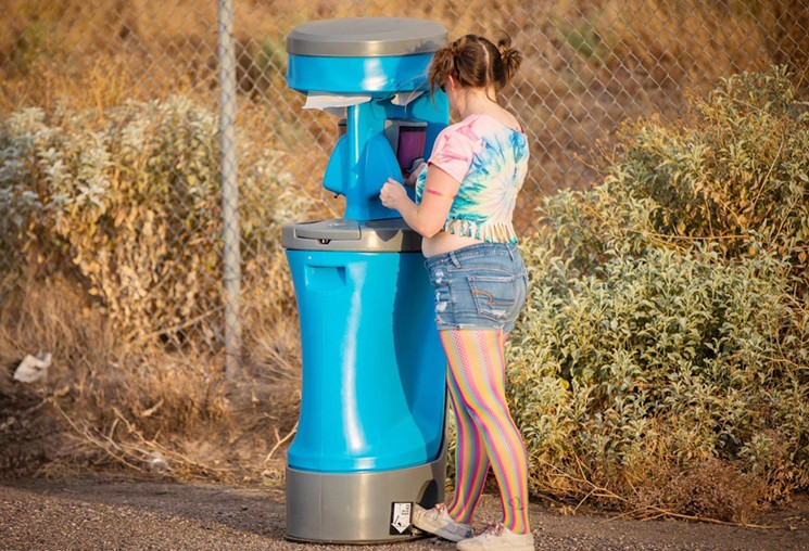 A sanitizing station at Relentless Beats' previous drive-in EDM event in May. - JACOB TYLER DUNN/RELENTLESS BEATS