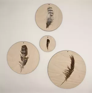 Wood-burning and watercolor prototypes for "A Murmuration of Found Feathers in Flight." - ALEXANDRA BOWERS