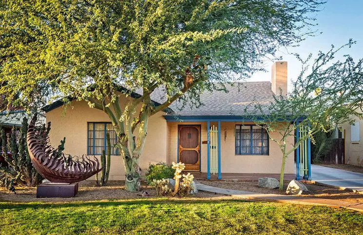 A metal sculpture adds character to the front yard of an F.Q. Story home. - STORY PRESERVATION ASSOCIATION