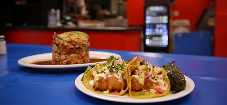 Fish tacos and the best-selling torre mixta, a tower of seafood, is on the menu at Sr. Ozzys Tacos y Mariscos. - TIM VASQUEZ