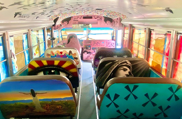 Several artists painted the backs of seats inside the "Let's Be Better Humans" bus. - JON LINTON