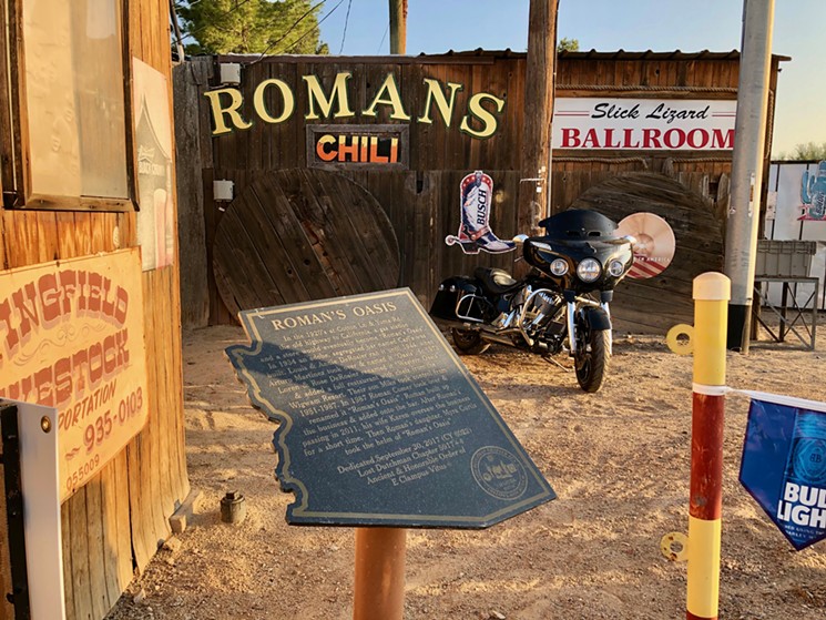 A plaque outside of Roman's Oasis gives the history of the bar and the Derosier Ranch. - LAUREN CUSIMANO