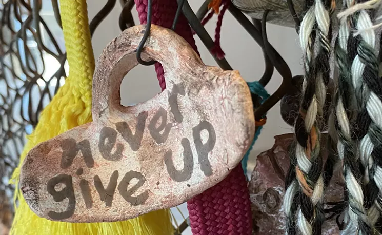 Detail of the Good Trouble Bucket installation created by Joan Baron and Gloria Martinez-Granados. - JOAN BARON