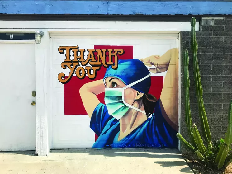 This tribute to essential workers was painted by Robert Gentile and El Spawk at Grand ArtHaus. - LYNN TRIMBLE