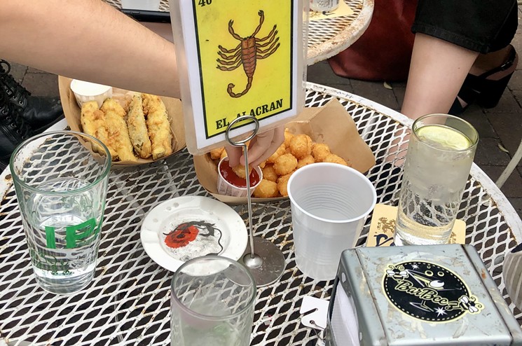 Snag some tots and a seat on the patio at Gracie's Tax Bar. - LAUREN CUSIMANO