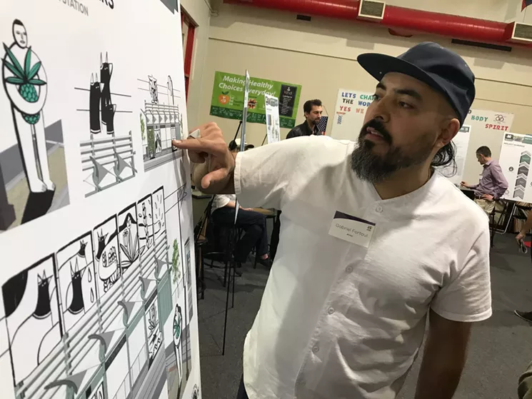 Gabriel Fortoul discussing an early Fourtoul Brothers light rail rendering during a community presentation. - LYNN TRIMBLE