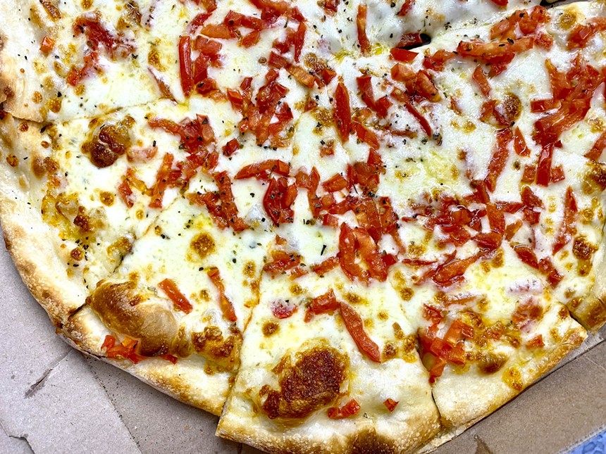 Red Devil's white pizza has a crispy crust and a cheesy middle. - ALLISON YOUNG