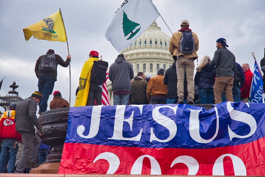 The pine tree flag appears at the January 6 protests at the U.S. Capitol in 2021. - BRETT DAVIS