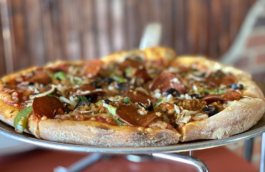 Order up an old-fashioned vegan pizza at Pizza Heaven Bistro. - ALLISON YOUNG