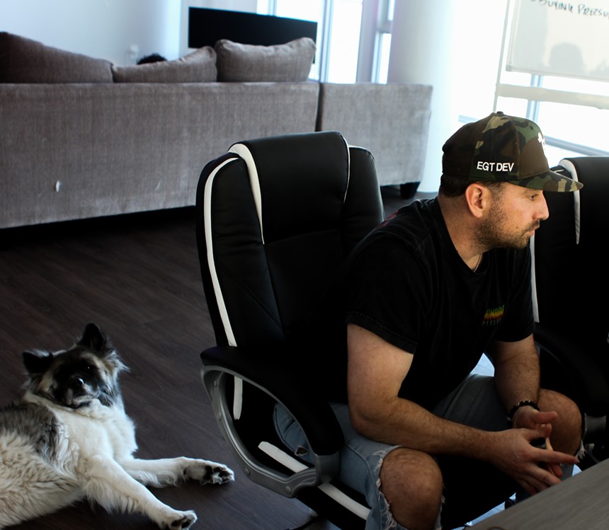 Ashley Sansalone, (left) the co-founder of cryptocurrency technology startup Elon Goat Token, is working out of a Tempe apartment. - CYRUS GUCCIONE