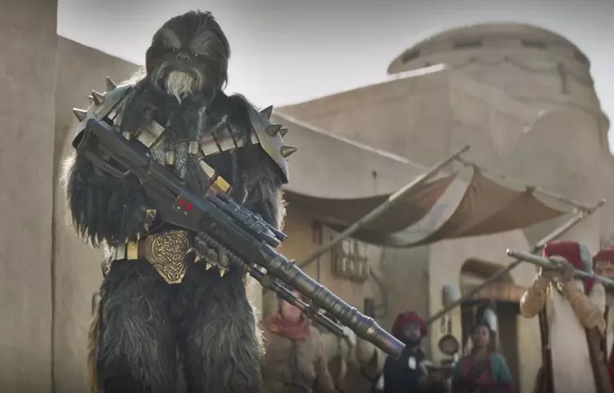 Carey Jones at Krrsantan from The Book of Boba Fett. - LUCASFILM/DISNEY