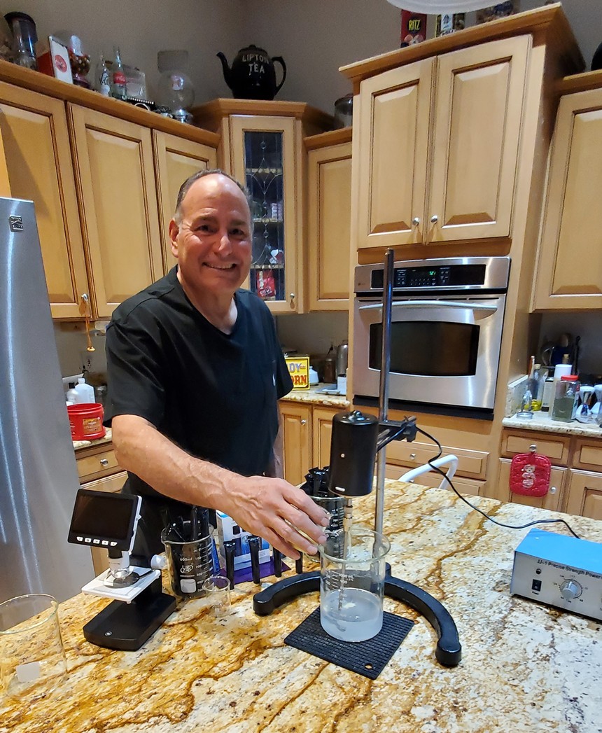 Joseph Verdone experimenting in his kitchen. The Scottsdale-based inventor introduces OMGX to the CBDa lubricant world. - SHARON NEWBILL