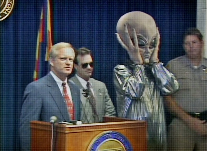 Governor Fife Symington (left) goofs on the Phoenix Lights sightings at a news conference in June 1997. A decade later, he’d claim he saw the lights the night they happened. - SCREEN CAPTURE