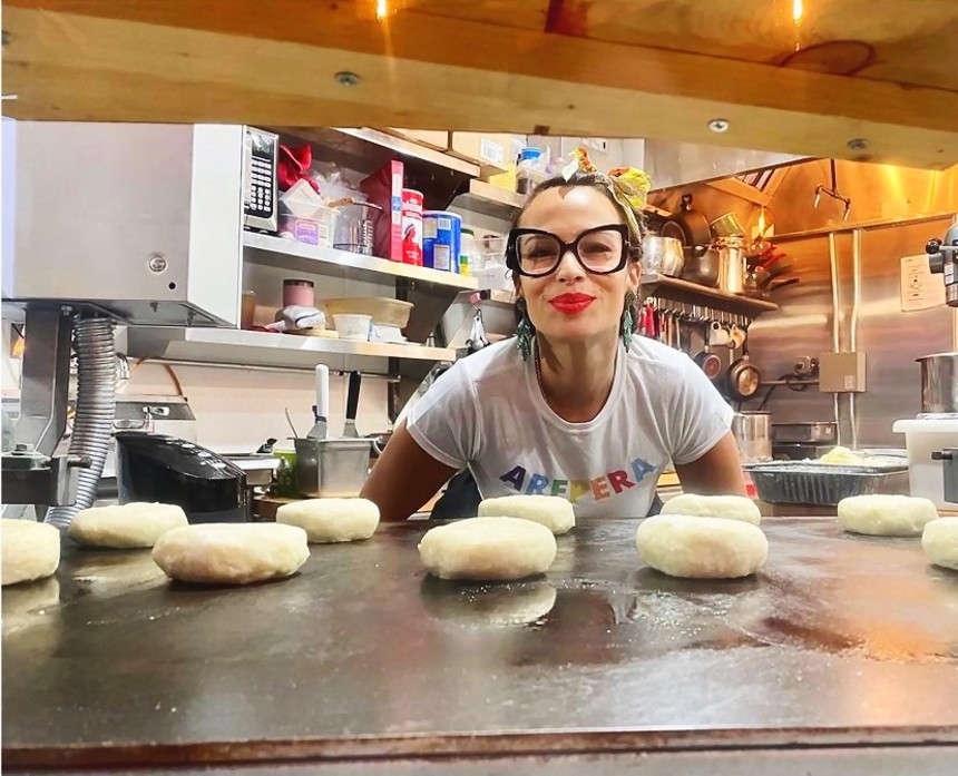 Owner Angelica Urrego with cheese-stuffed arepas at Arepa Babe. - AREPA BABE