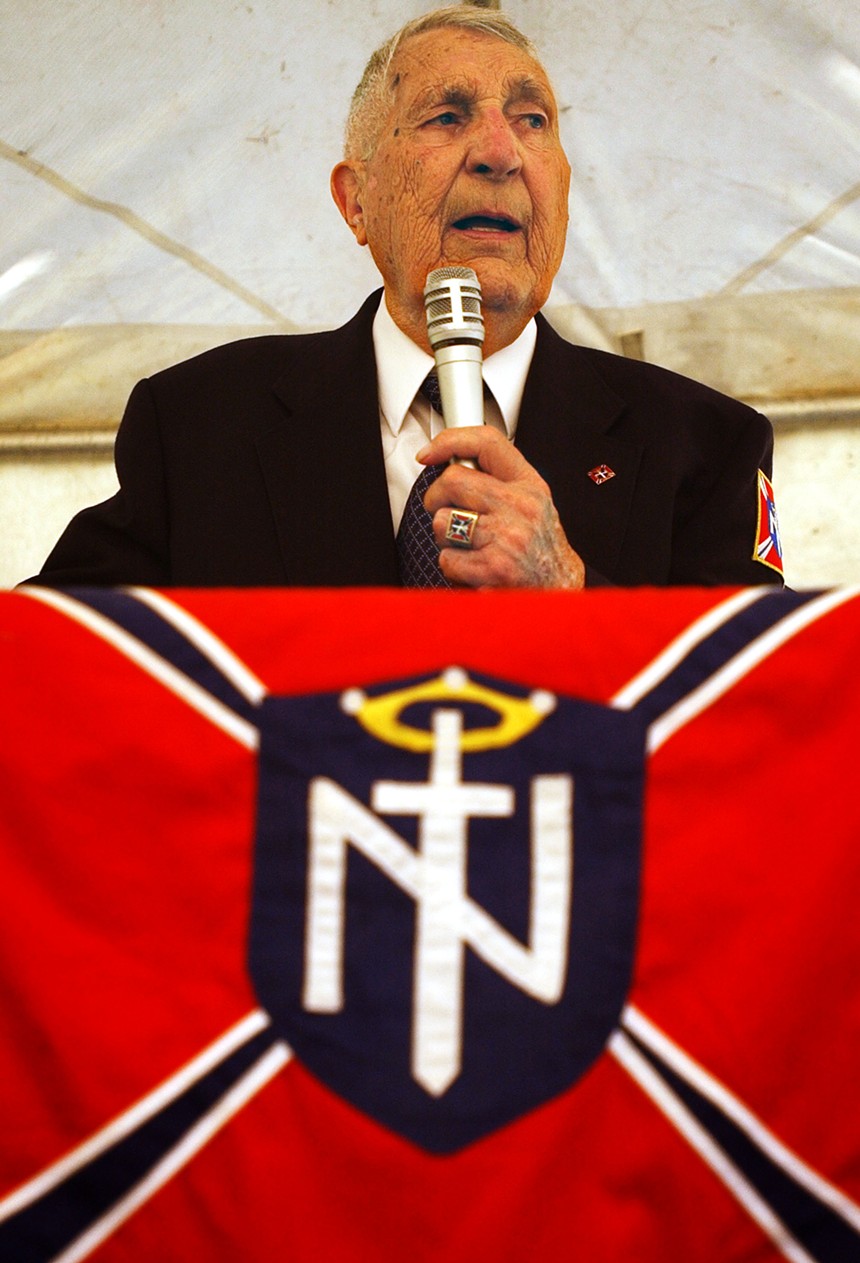 Rev. Richard Butler gives a speech during the Aryan World Congress July 17, 2004 held in Cataldo, Idaho. Butler is the leader of the Aryan Nations that went bankrupt after a lawsuit in 2000 forcing the group to rent spaces for their annual world congress. - JEROME A. POLLOS/GETTY IMAGES
