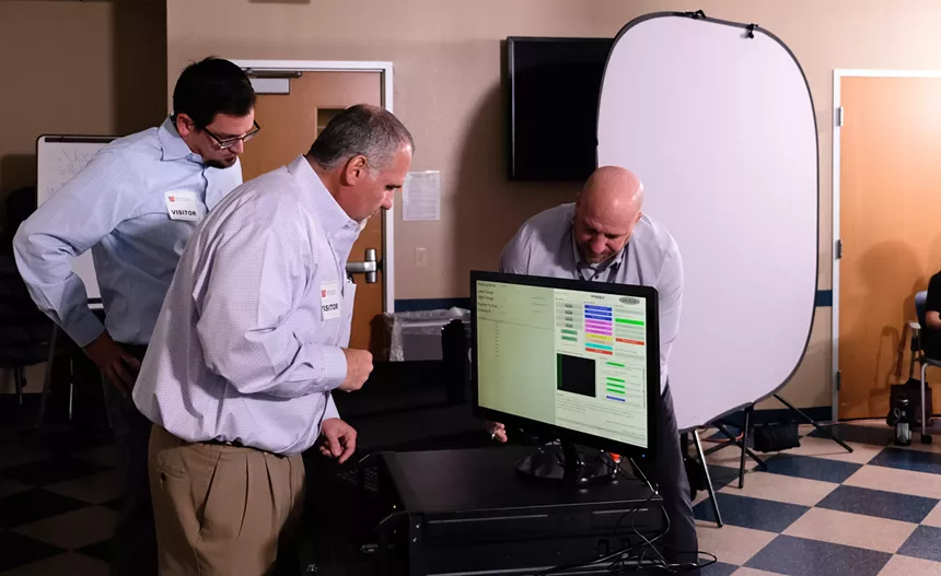 Independent auditors ready the lottery system at the headquarters of the Arizona Department of Health Services. - KATYA SCHWENK