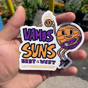 La Purisima Bakery created a character that's printed on stickers and tote bags to cheer on the team. - LA PURISIMA BAKERY