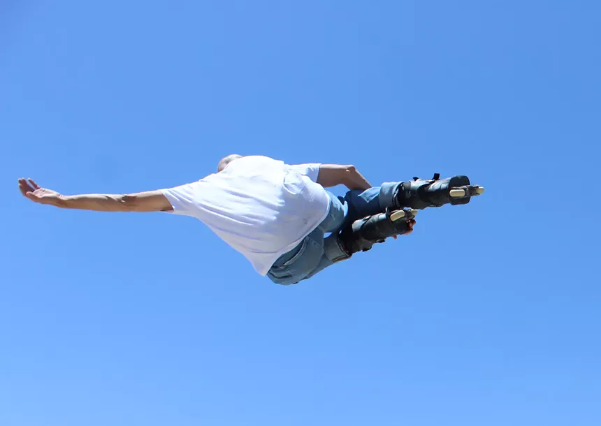 Phoenix native Chad Hornish catches some serious hang time after launching off a concrete ramp at Anthem Community Skate Park. - ELIAS WEISS