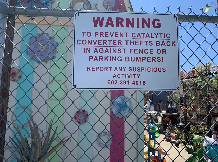 Gabriel Hernandez placed this sign warning customers about rampant catalytic converter theft in Phoenix in the parking lot of his business, Trans Am Cafe on Grand Avenue. - KRISTEN MOSBRUCKER