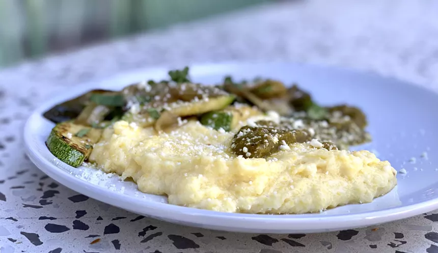 The Lite Bites menu features polenta served with poblano-tomatillo sauce and roasted vegetables. - ALLISON YOUNG