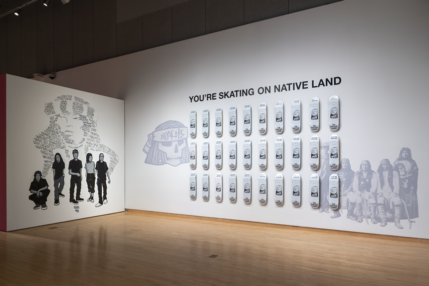 Douglas Miles, You're Skating on Native Land, 2022. Apache - skateboards, vinyl. Courtesy of the artist. Installation view of Desert - Rider, 2022, Phoenix Art Museum. Courtesy of Phoenix Art - Museum. - AIRI KATSUTA