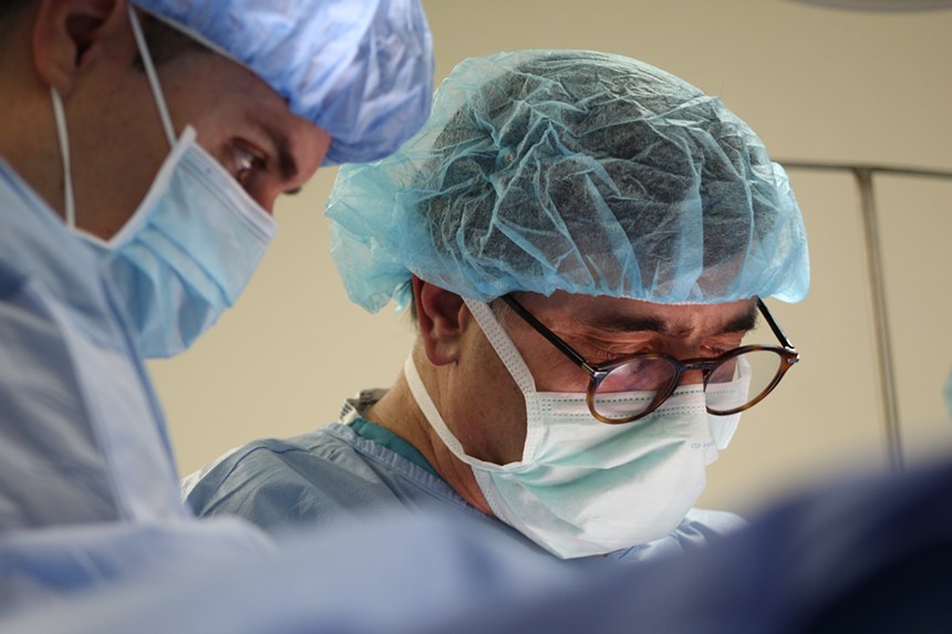 dr  Joseph Abdo (right), a general surgeon in Mesa, performs surgery at Hospital General de Puerto Peñasco on Saturday morning.  - ELIAS WEISS