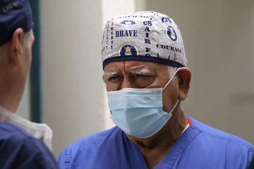 Dr. Raul Osorio (right), a gynecological surgeon from Peru, discusses an operation with Phoenix anesthesiologist Dr. Floyd Roberson. Osorio set up a nonprofit in Mesa that recently began working to improve the quality of health care in the Mexican state of Sonora. - ELIAS WEISS