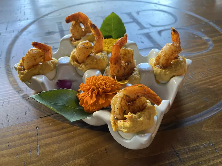 The La Di-Da-Dis, deviled eggs topped with grilled Cajun shrimp, are a customer favorite, Fields says. - NATASHA YEE