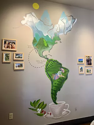 A map at Cafetal Coffee shows the journey the beans make from the owners' family farm in Colombia to Tempe. - TIRION MORRIS