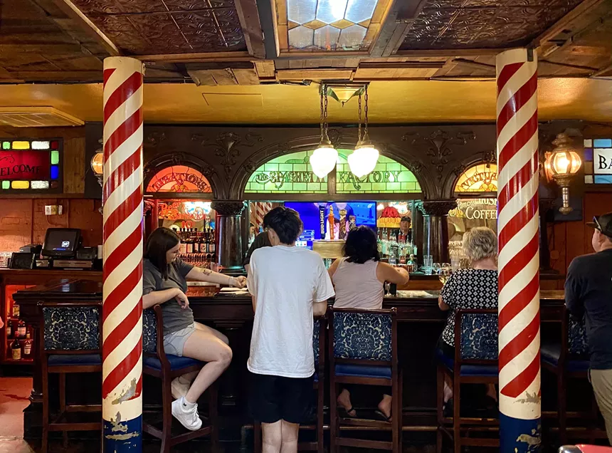 The bar has wood accents and candy cane columns. - ALLISON YOUNG