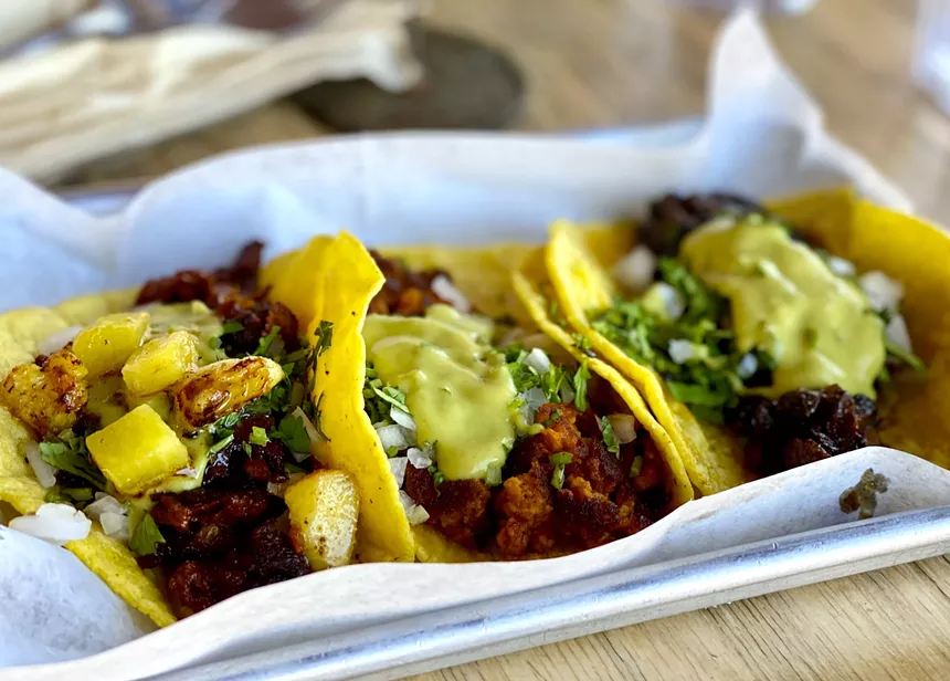 A trio of vegan tacos from Earth Plant Based Cuisine. - ALLISON YOUNG