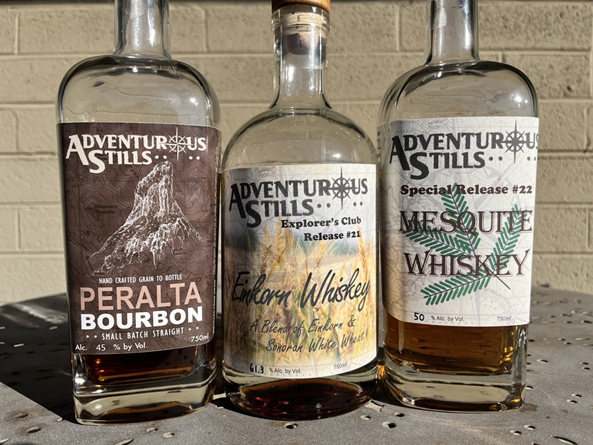 Three bottles of Adventurous Stills spirits.