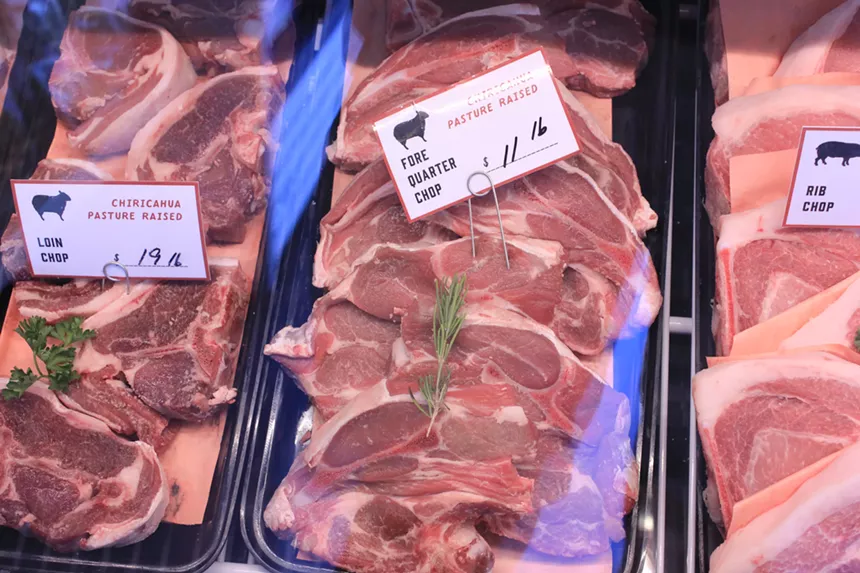 Lamb and pork chops in a case.