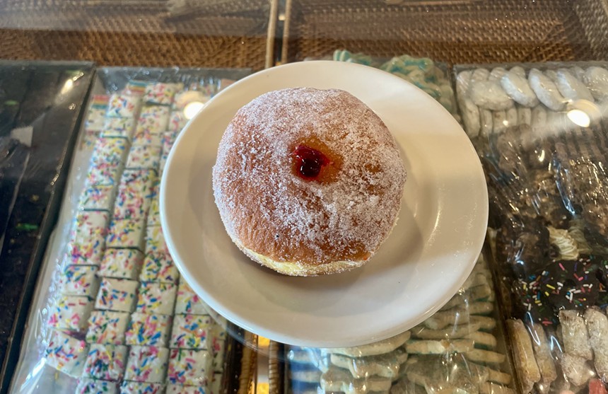 A jelly-filled doughnut on a plate at Scott's Generations.