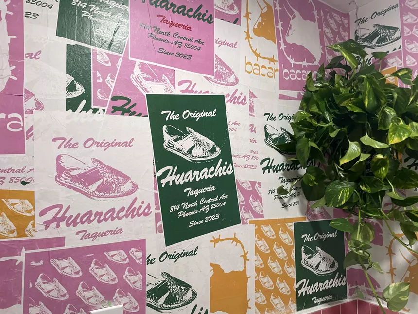 The wallpaper in the bathroom at Huarachis is made from flyers for the restaurant.
