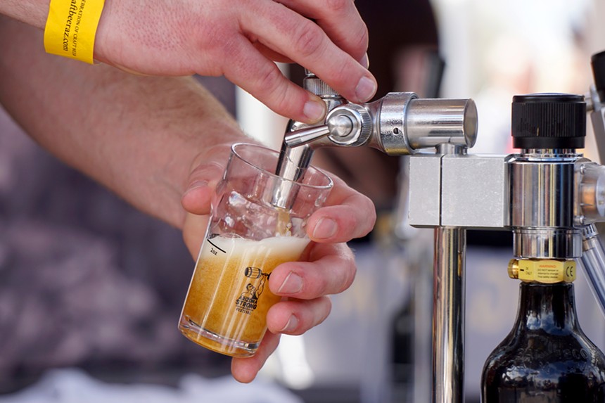 Pouring a sample of beer.