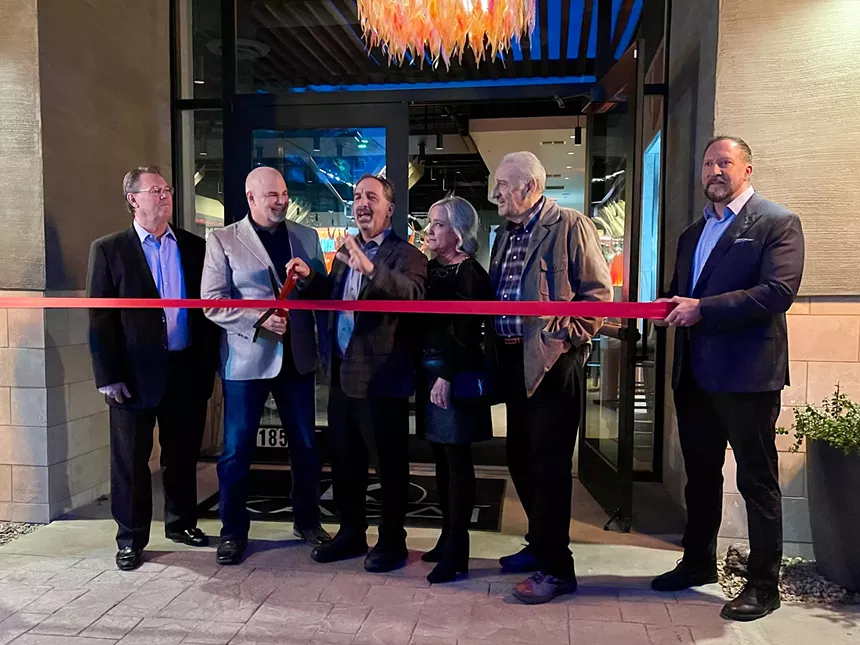 Kasai owners and the mayor of Peoria cut a red ribbon.
