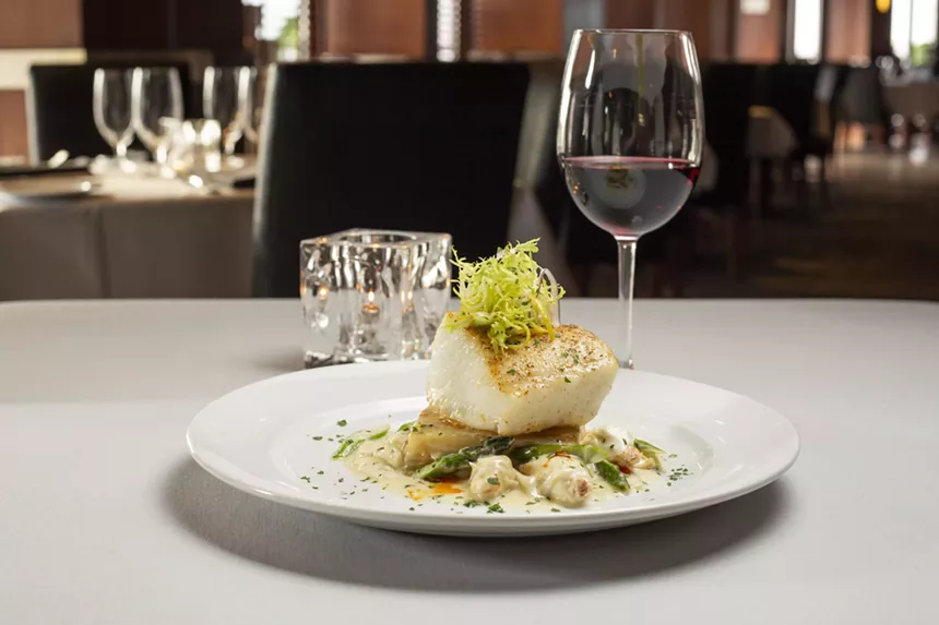 Fish entree with wine.