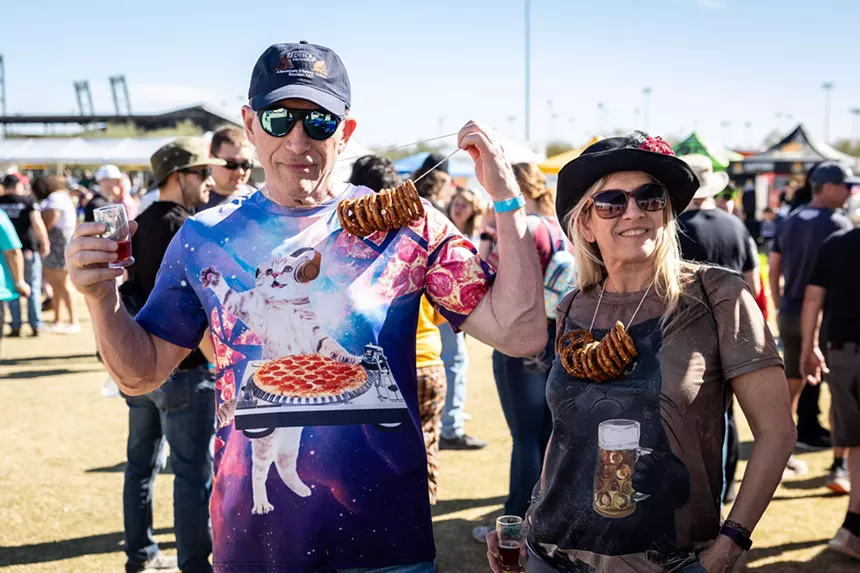 Couple post with pretzel necklaces.