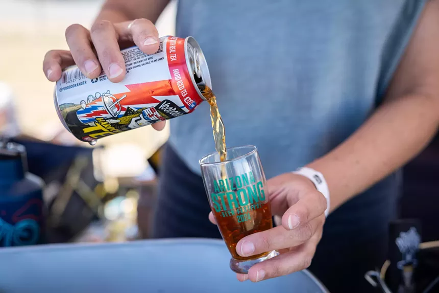 Pouring strong iced tea.